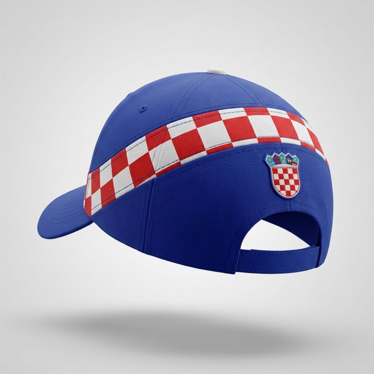 Blue cap with a red and white checkered band and emblem on a light gray background