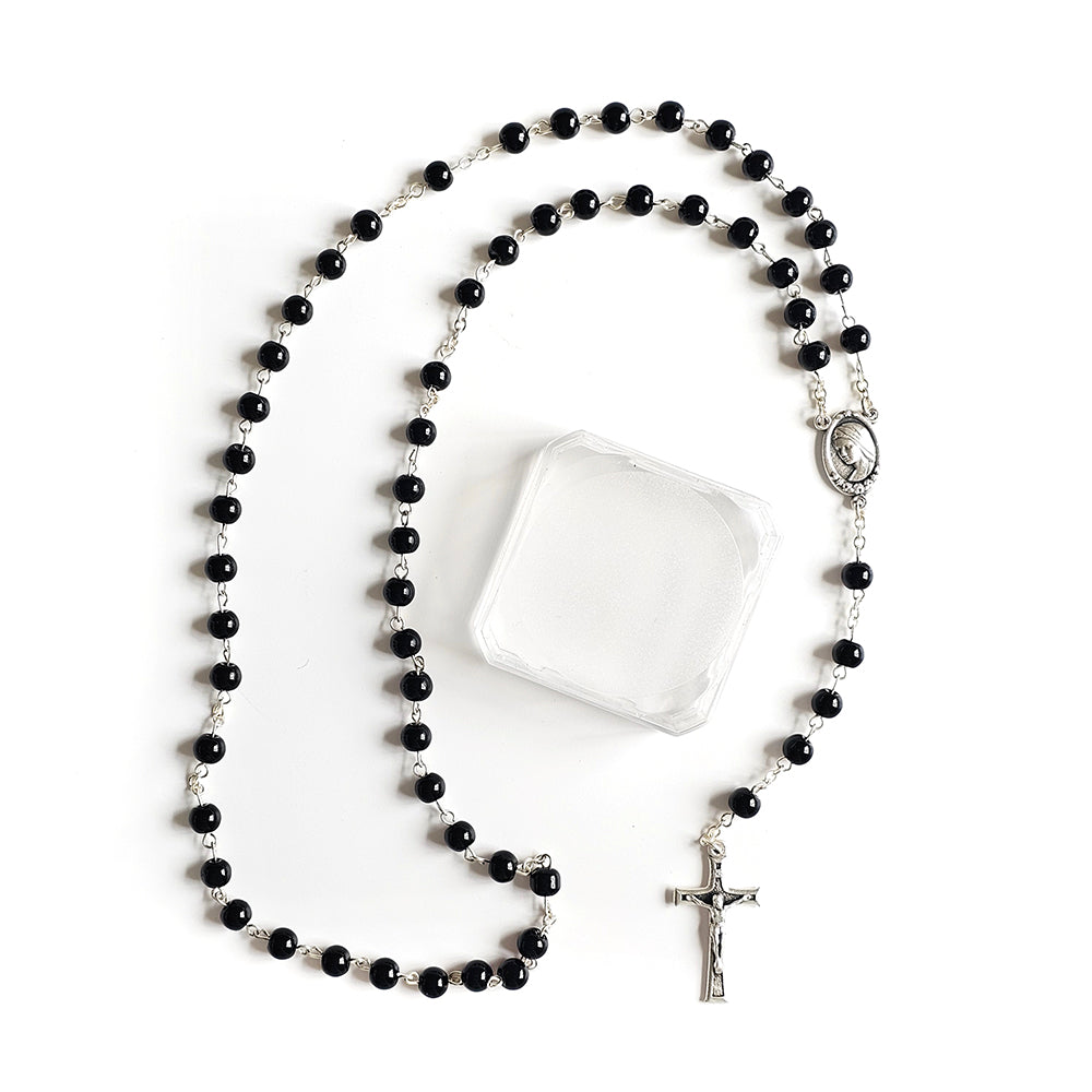 Black Catholic Rosary – Silver Crucifix & Marian Medal Black rosary with a silver cross on a white background