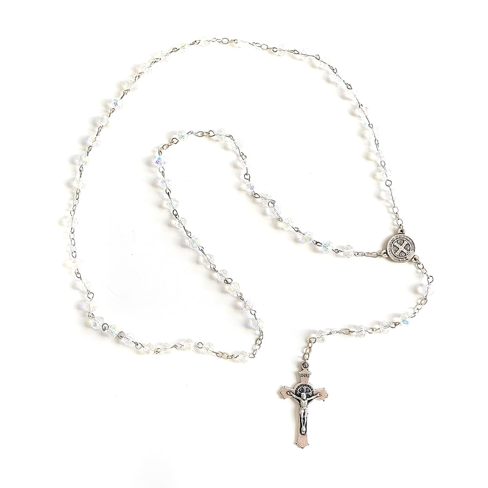 Clear Crystal Saint Benedict Rosary – Silver Crucifix & Medal Rosary necklace with beads and a cross pendant on a white background