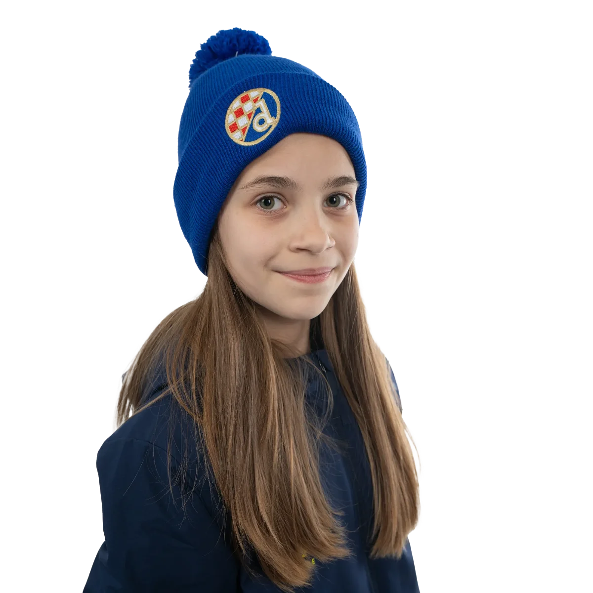 Kids Beanie Dinamo Zagreb Pom Pom Child wearing a blue beanie with a logo on a white background