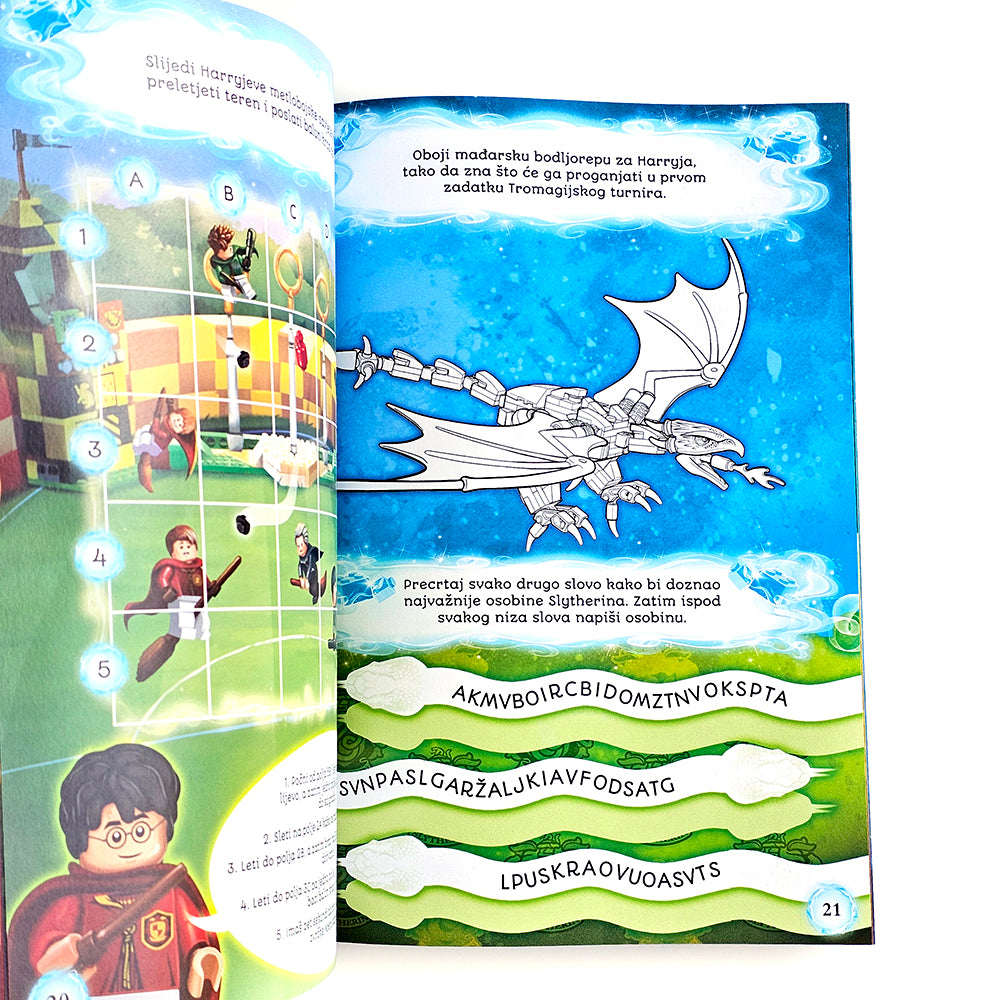 Lego Harry Potter - Pustolovine u Hogwartsu Open book with illustrations of a dragon and characters, likely from a children's book.