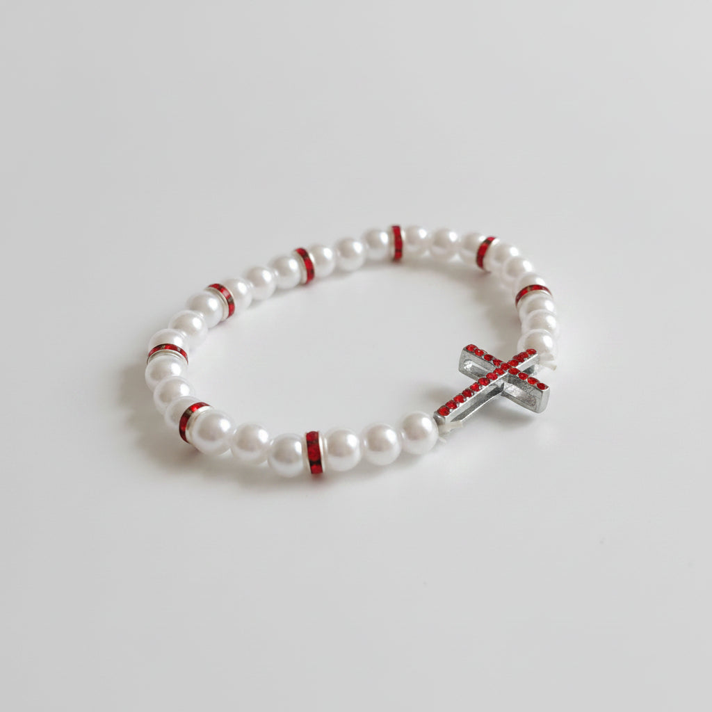 Red & White Cross Bracelet – Handmade Elastic Beaded Jewelry White beaded bracelet with red accents and a silver cross charm on a white background