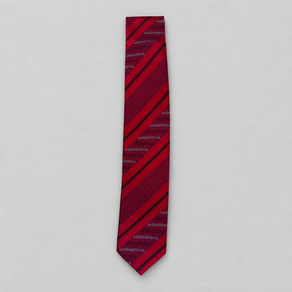 Silk Tie Croatia – Glagoljica by Croata (Kravata) Red and black striped tie with brand name on a light gray background snc shopncro