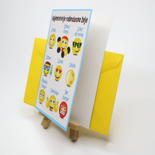 Sretan Rođendan Emoji Birthday Card Greeting card with smiley face designs on a stand with a yellow envelope.