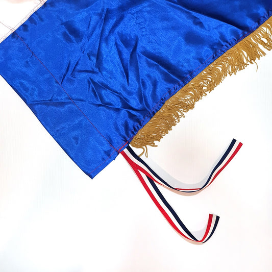 Official Croatian Silk Flag 200cm x 100cm Blue graduation gown with gold trim and a red, white, and blue tassel on a white background