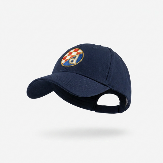 A navy blue baseball cap featuring an embroidered Croatian flag patch on the front, displayed against a clean white background with a soft shadow underneath. Baseball Cap Dinamo Zagreb in Navy Blue shopncro.live