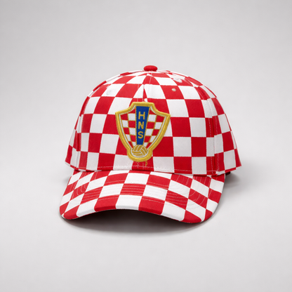 Red and white checkered cap with a logo on a light gray background