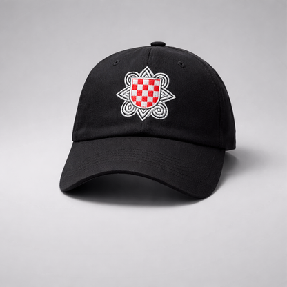 Baseball Cap Prvo Bijelo Polje Black cap with a red and white emblem on a gray background