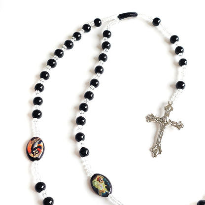 Black & White Catholic Rosary with Religious Medals – Silver Crucifix Black and white rosary with colorful oval beads and a silver crucifix on a white background