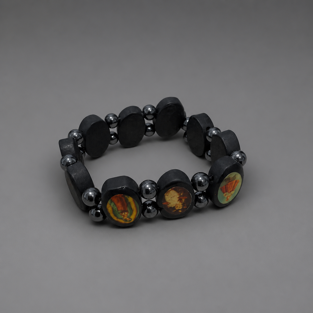 Bracelet Međugorje in Black Black beaded bracelet with silver accents on a gray background