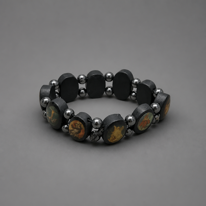 Bracelet Međugorje in Black Black beaded bracelet with silver accents on a gray background