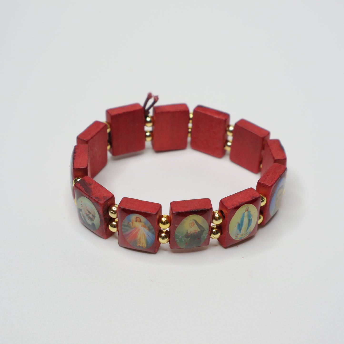 Bracelet Međugorje in Walnut Red bracelet with hexagonal beads featuring artistic designs on a white background