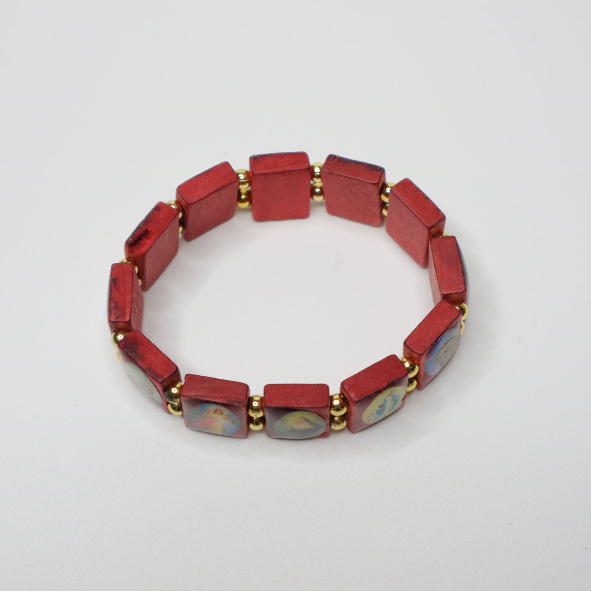 Bracelet Međugorje in Walnut Red bracelet with gold accents on a white background