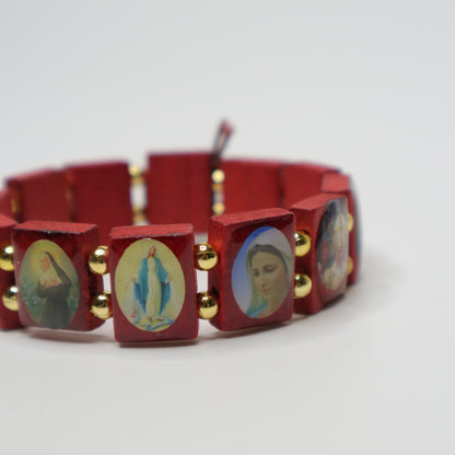 Bracelet Međugorje in Walnut Red bracelet with religious-themed charms on a white background