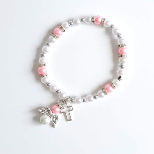 Bracelet Pink & White Angel Cross Bracelet with white and pink beads and a cross charm on a white background