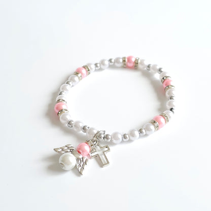 Bracelet Pink & White Angel Cross Bracelet with white beads, pink accents, and a silver cross charm on a white background