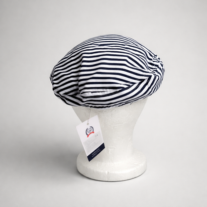 Captain Hat Croatia Dalmatinac Striped beret on a mannequin head with a tag against a gray background