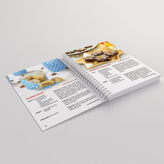 Kolači, čarolija užitka 2 Open cookbook showing recipes and images of desserts on a light gray background