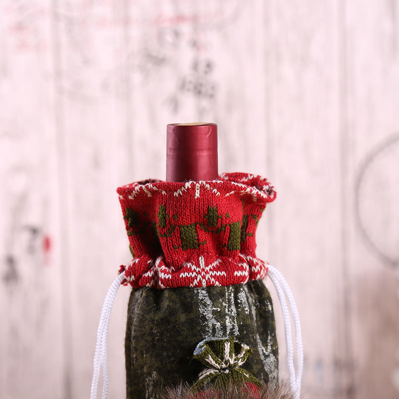 Christmas Bottle Cover – Santa, Snowman & Reindeer Decorative bottle with a red knitted cover featuring green patterns on a blurred background shopncro