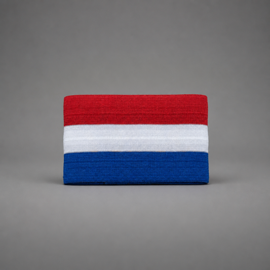 A rectangular knit fabric item, likely a headband or wristband, featuring horizontal stripes of red, white, and blue, centered on a solid gray background. Croatia Captain Armband