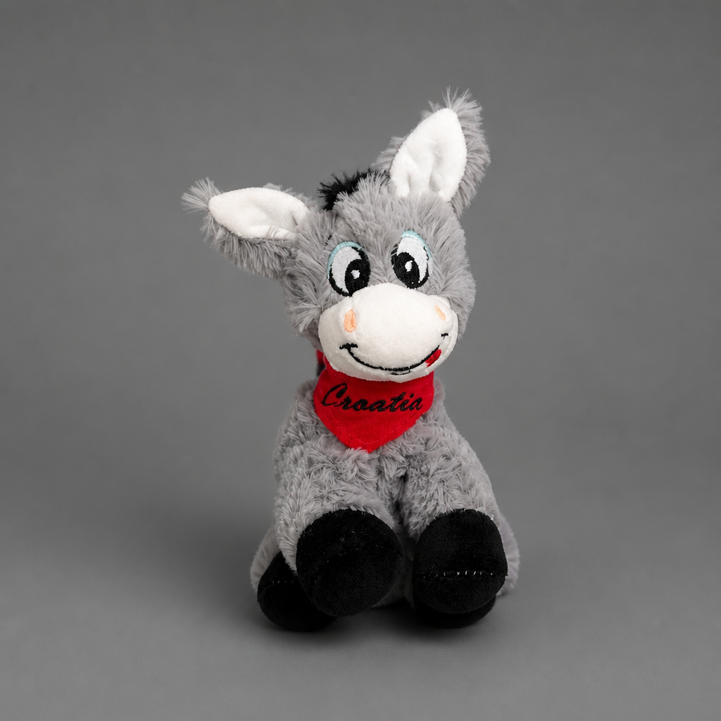 Croatian Plush Donkey - Magarac Plush donkey toy with a red scarf on a gray background shopncro