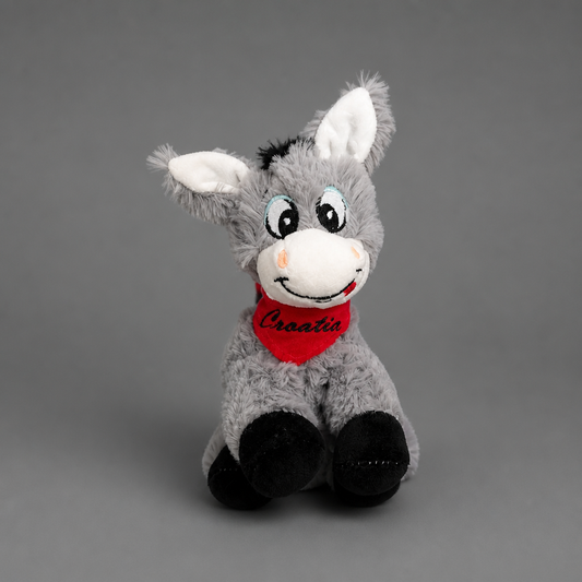Croatian Plush Donkey - Magarac Plush donkey toy with a red scarf on a gray background shopncro