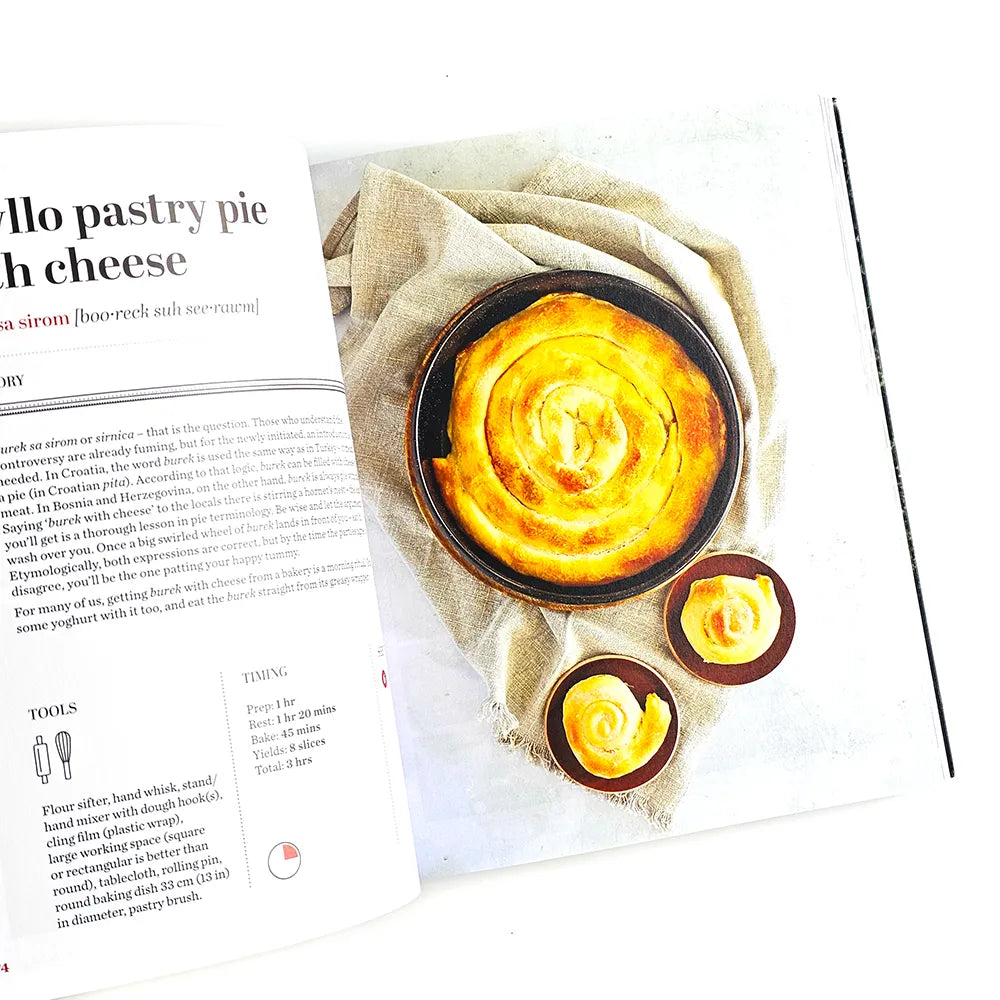Croatian Savoury Baking: Cookbook in English Language Pastry pie with cheese on a newspaper page
