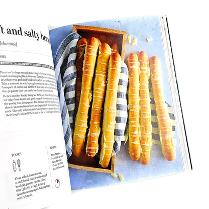 Croatian Savoury Baking: Cookbook in English Language Wooden tray with bread rolls on a magazine page