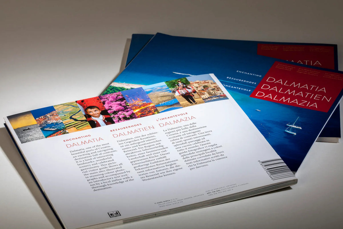 Dalmatia – Dalmatien – Dalmazia Brochures with travel images and text on a light surface