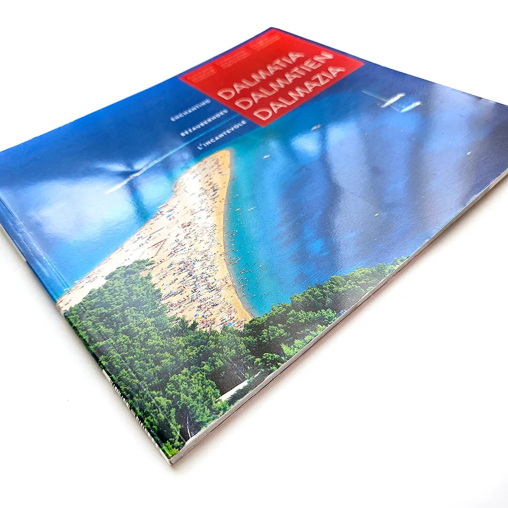 Dalmatia – Dalmatien – Dalmazia Book cover with a scenic view of a coastal area and the word 'Dalmatia' on a white background