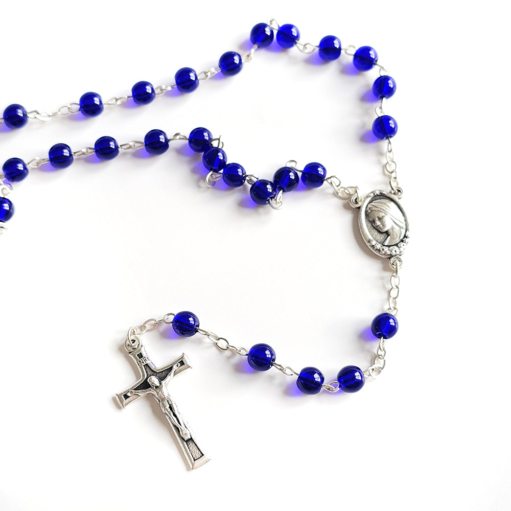 Dark Blue Catholic Rosary – Silver Crucifix & Marian Medal Blue rosary with silver cross and medal on a white background