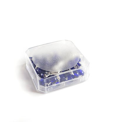 Dark Blue Catholic Rosary – Silver Crucifix & Marian Medal Clear plastic container with blue and silver contents on a white background