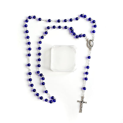 Dark Blue Catholic Rosary – Silver Crucifix & Marian Medal Blue rosary with a silver cross on a white snc shopncrobackground