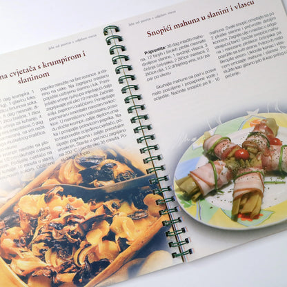 Ekološka Kuharica Open cookbook showing images of food and text on a white background