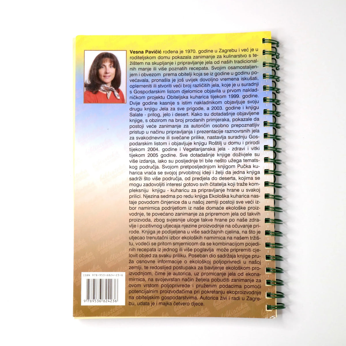 Ekološka Kuharica Spiral-bound book with a woman's portrait on the cover, displayed against a white background.