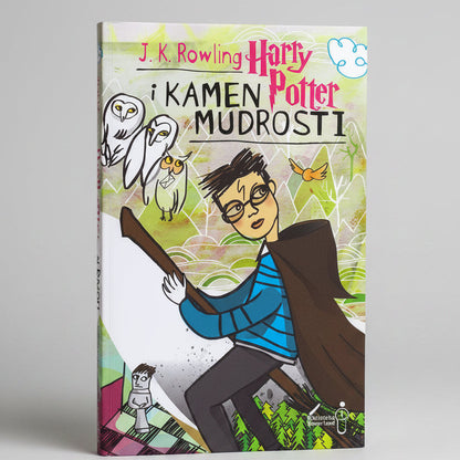 Harry Potter 7 Books Box Set (Croatian) Book cover of 'Harry Potter i Kamen Mudrosti' with cartoon-style illustration of a character holding a broomstick.