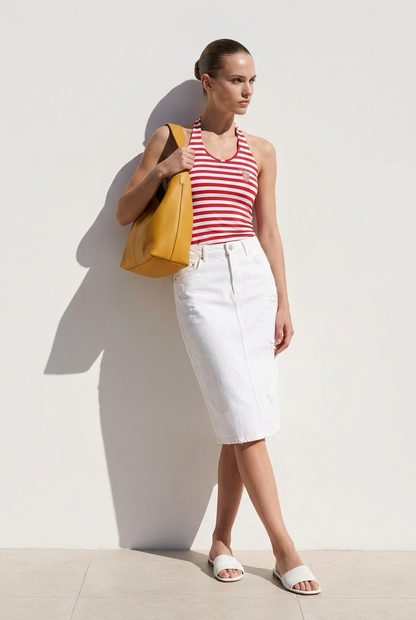 Halter Neck Top Croatia Woman wearing a red and white striped tank top and white skirt, holding a yellow bag against a white background.