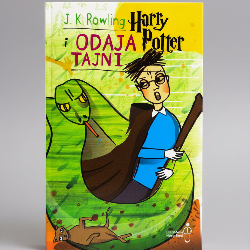 Book cover of 'Harry Potter i Odaja Tajni' with cartoon-style illustration of Harry Potter and a snake.