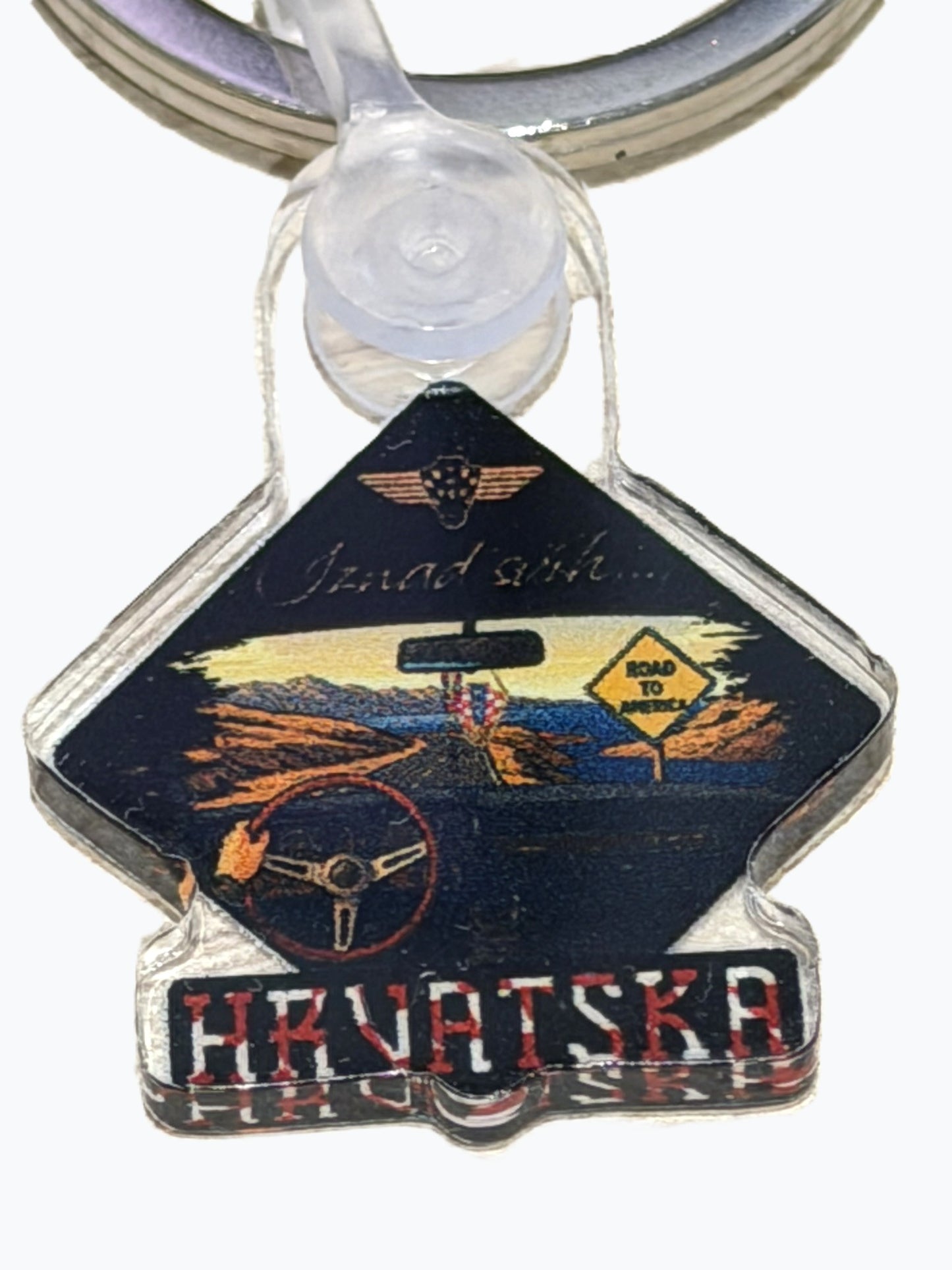 Hrvatska Iznad svih… acrylic Keychain Keychain with a diamond-shaped design featuring a car interior and text on a white background