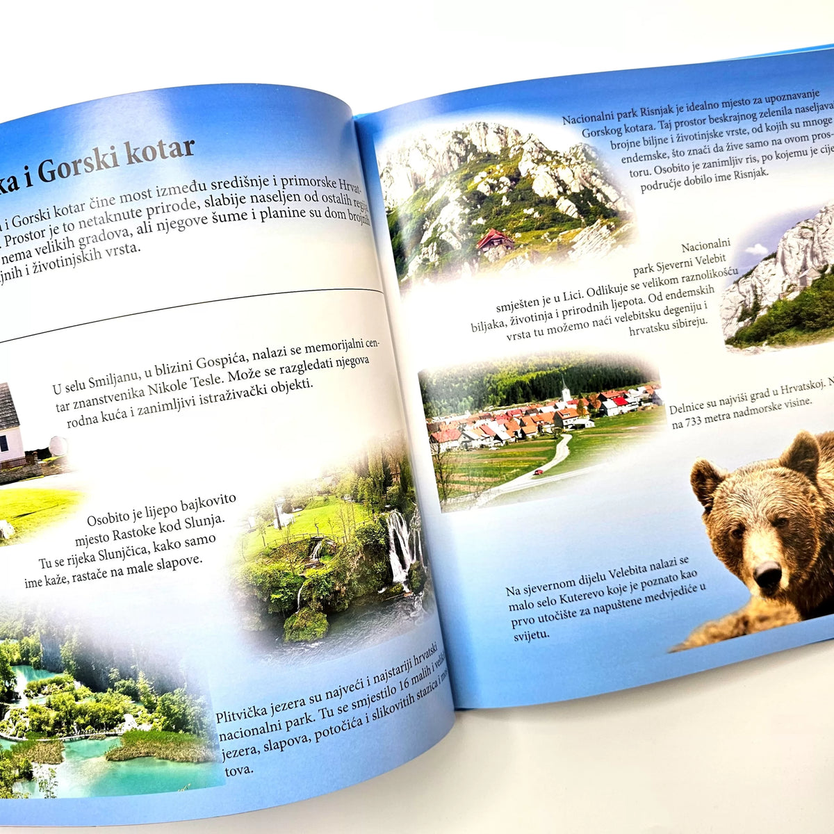 Hrvatska – Veseli Zemljopis Open book with scenic illustrations and text on a white background