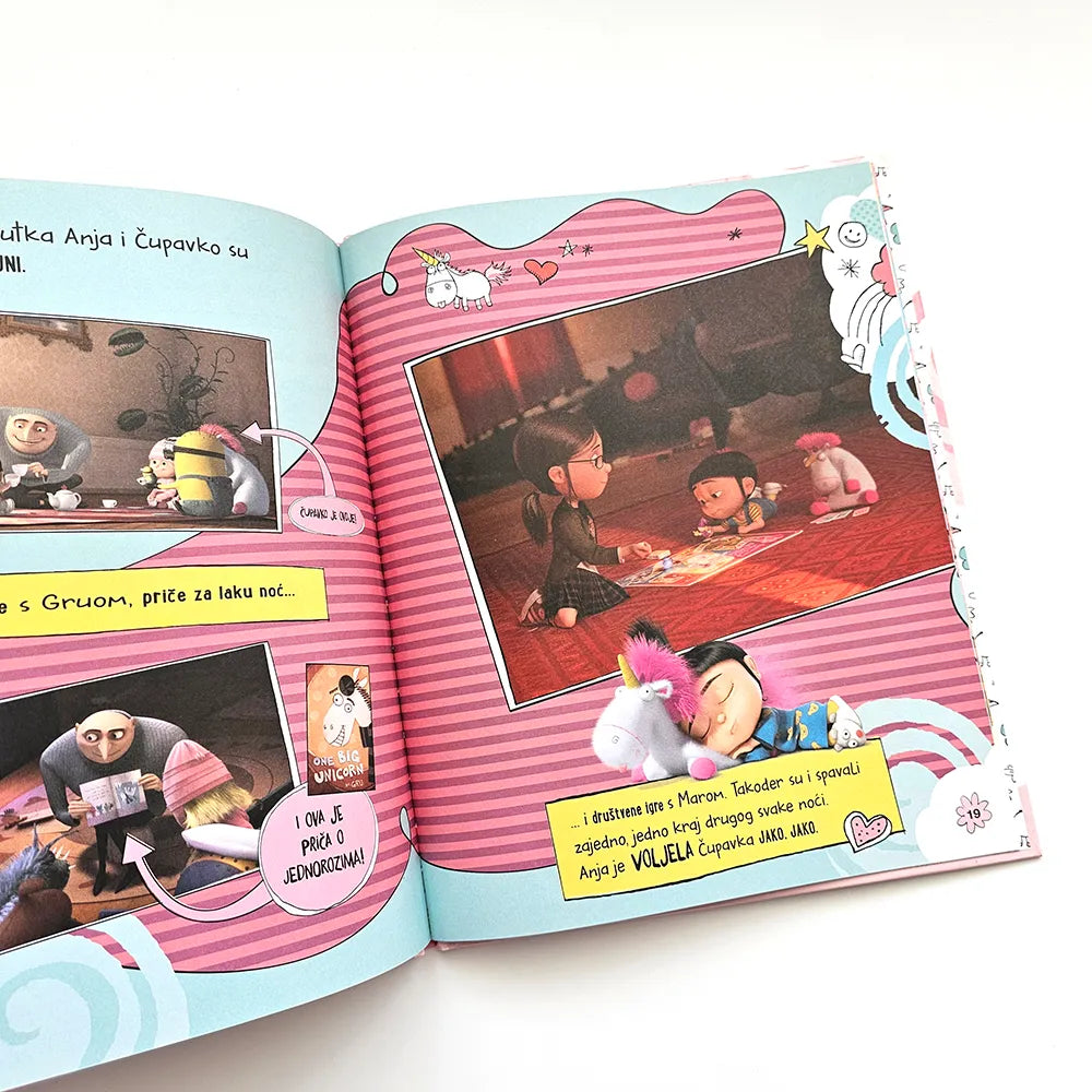Kako je Gru Postao Dobar Anja Voli Jednoroge! Open book with animated characters and colorful illustrations on a white background