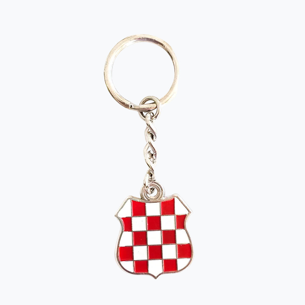 Keyring Prvo Bijelo Polje Shield Keychain with red and white checkered shield design on a white background