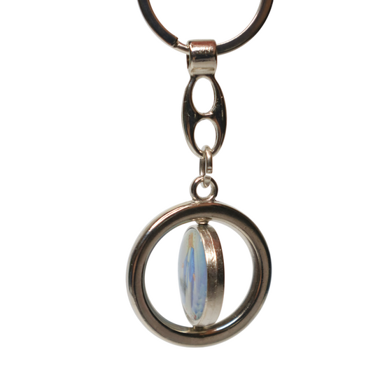 Keyring Virgin Mary & Saint Anthony Rotating Spinner Keychain with a circular design and a central gemstone on a white background