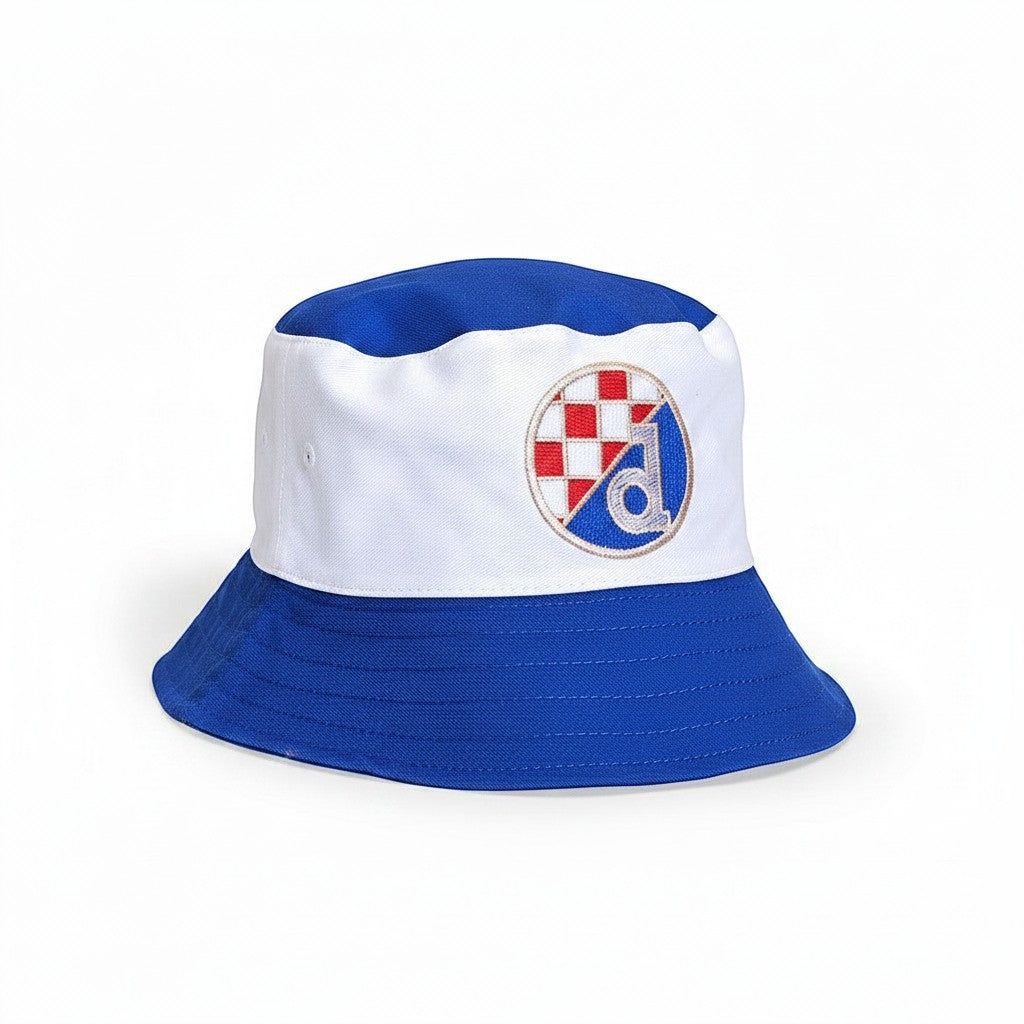 Kids Bucket Hat Dinamo Zagreb - Shop n Cro blue and white bucket hat with embroidered crest, red checkered pattern, and blue 'd' emblem. Wide brim for sun protection. cro shop