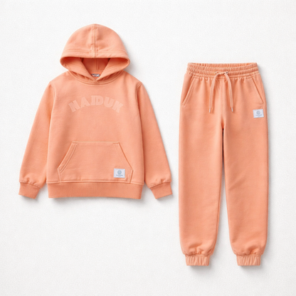 Peach-colored hoodie and jogger pants set on a light gray background Kids Tracksuit Hajduk snc shopncro