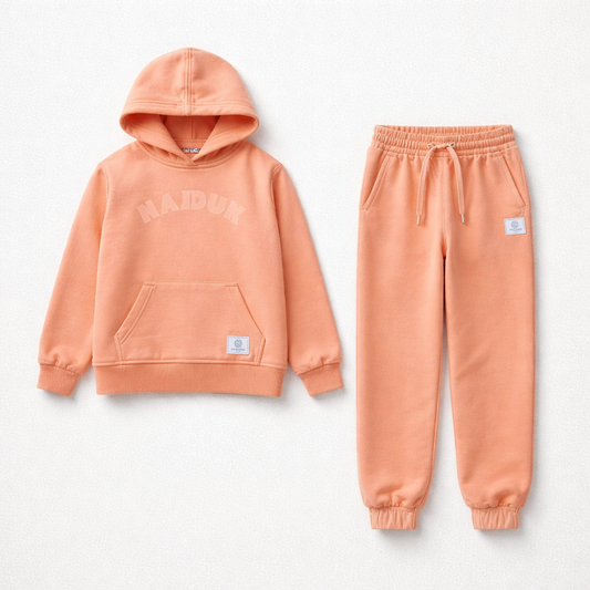 Peach-colored hoodie and jogger pants set on a light gray background Kids Tracksuit Hajduk snc shopncro