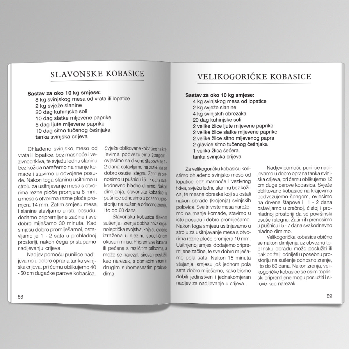Kolinje i Mesni Specijaliteti Open book showing two pages with text in a foreign language on a white background