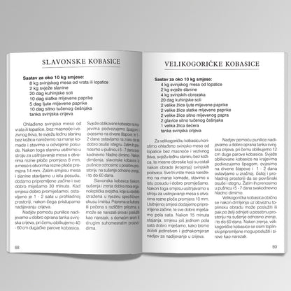 Kolinje i Mesni Specijaliteti Open book showing two pages with text in a foreign language on a white background