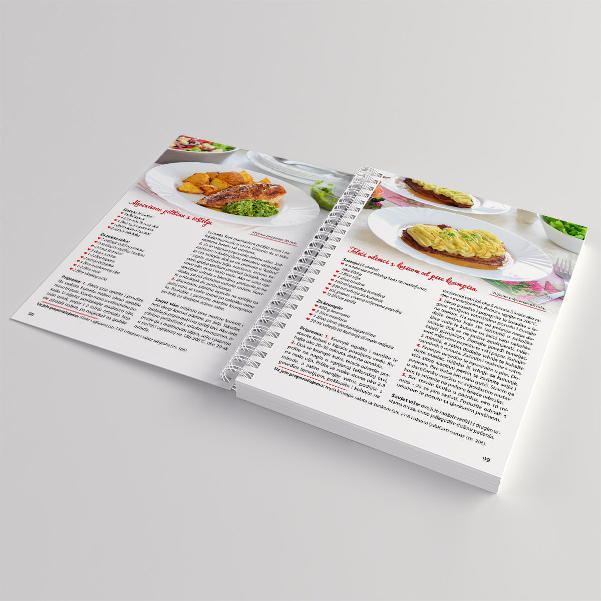 Kuhaj Slano, Kuhaj Fino! Open cookbook showing recipe pages with images of food on a light gray background
