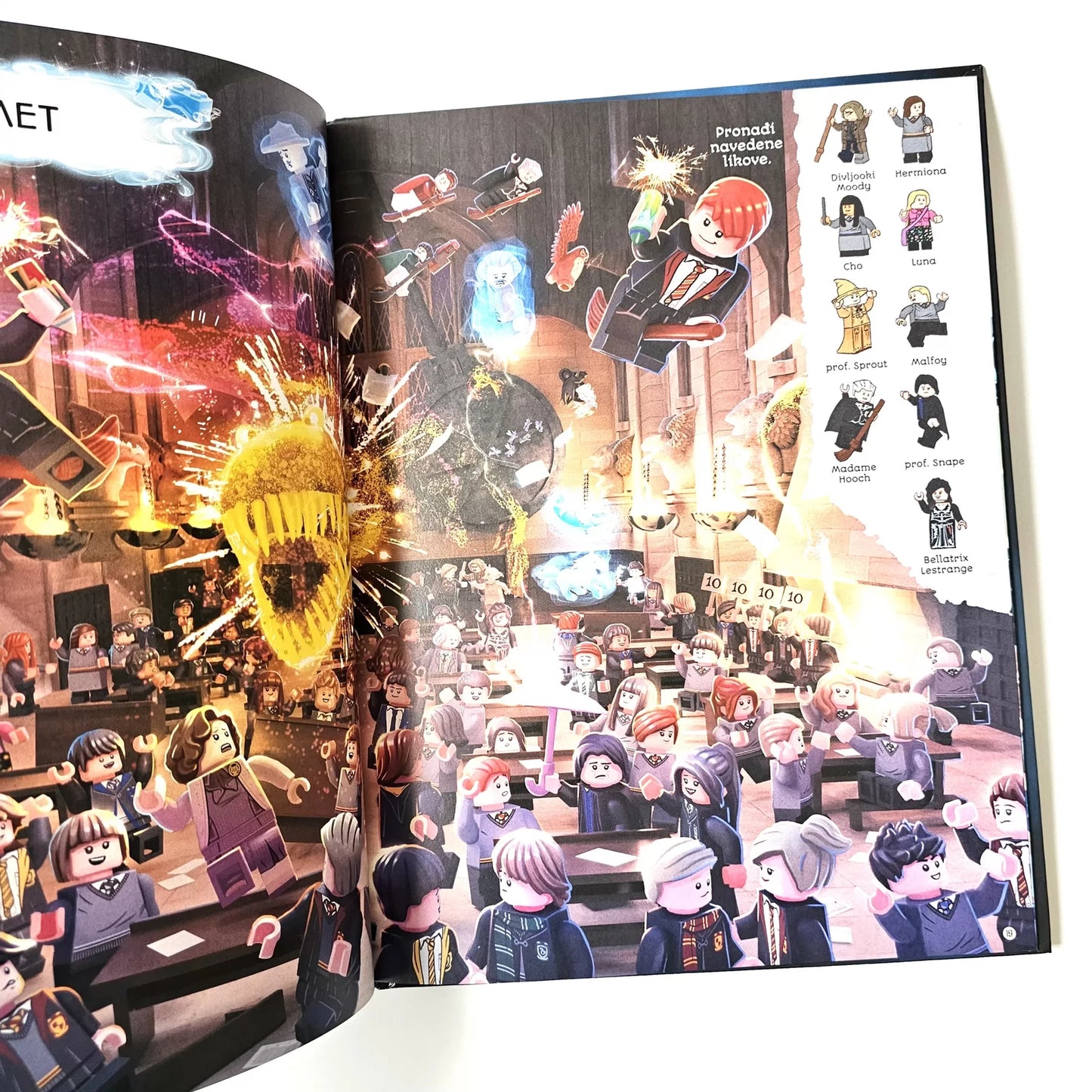 LEGO Harry Potter – Čarobna Potraga Open book with colorful illustrations of characters and scenes, featuring a variety of figures and designs.